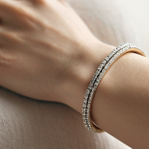 **

*   **Prompt:** Close-up photo of a slender wrist adorned with a delicate white gold bracelet. Focus on the subtle sparkle and the bracelet's fine chain. Soft, diffused lighting to emphasize elegance. Background: blurred neutral tones.

**